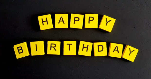 Its My Birthday Wallpaper featuring yellow scrabble tiles spelling 'Happy Birthday' on a dark, textured surface
