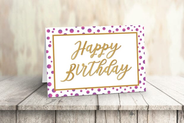 Its My Birthday Wallpaper featuring a festive Happy Birthday card on a rustic wooden table with a blurred background
