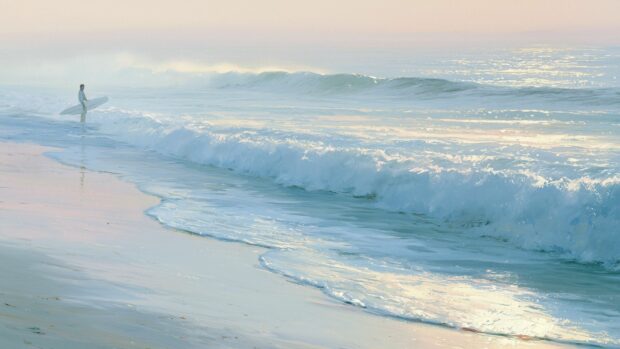 A serene ocean wallpaper featuring a lone surfer standing by gentle waves on a misty beach at sunrise