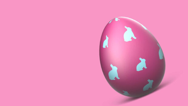 A minimalist Easter egg wallpaper featuring a pink egg with light blue bunny patterns on a soft pink background