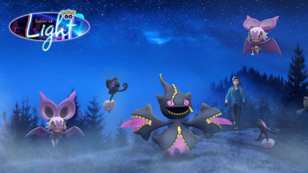 A Pokemon Halloween wallpaper showing ghost and dark type Pokemon in a misty blue forest at night with a trainer