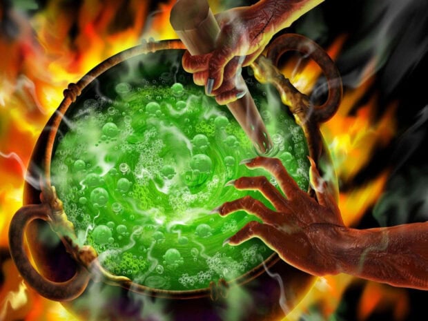 A spooky preppy Halloween wallpaper depicting witch hands stirring a bubbling green potion in a cauldron amidst flames
