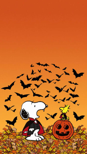 A festive Snoopy Fall Wallpaper featuring Snoopy as a vampire with Woodstock on a jack-o'-lantern, surrounded by flying bats and autumn leaves