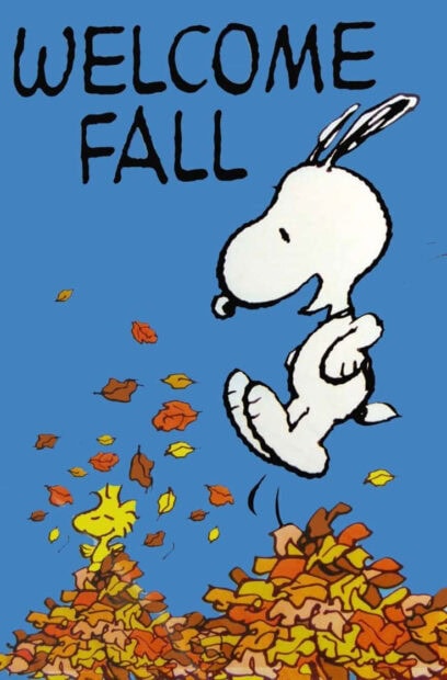 A vibrant Snoopy Fall Wallpaper showing Snoopy happily jumping into a large pile of colorful autumn leaves with "WELCOME FALL" text