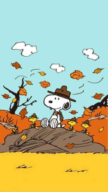 Snoopy Fall Wallpaper featuring Snoopy in a scout hat with Woodstock characters among falling autumn leaves