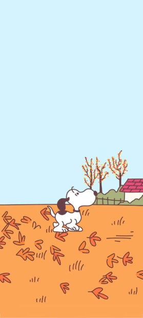 A charming Snoopy Fall Wallpaper showing Snoopy sitting among autumn leaves under a clear blue sky with distant trees and a house