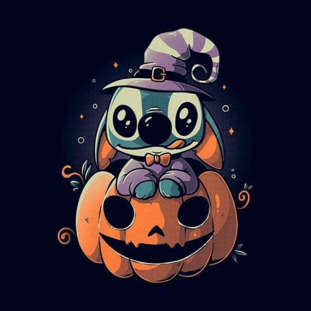 A charming Stitch Halloween wallpaper featuring a chibi Stitch wearing a witch hat, sitting on a carved pumpkin against a dark background with sparkling details