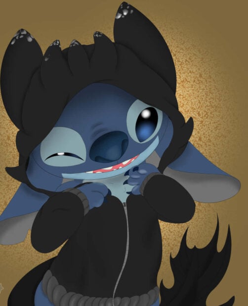 A cute Stitch Halloween wallpaper depicting Stitch in a black hoodie with dragon features, winking playfully against a warm golden background