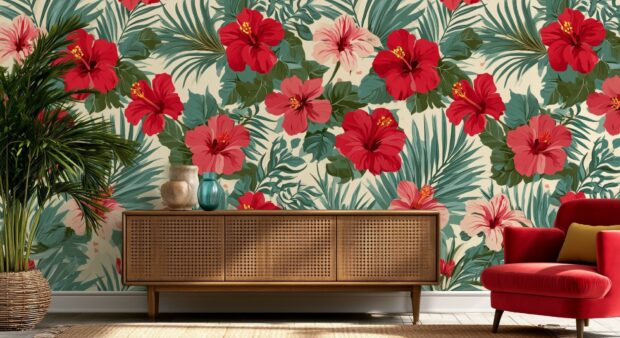 Flower wallpaper featuring a tropical pattern of red hibiscus flowers and green palm leaves on a wall in a stylish home interior with furniture