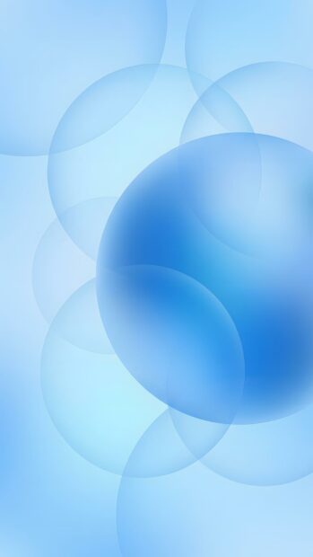 This abstract digital wallpaper features various sizes of blue transparent bubbles and spheres subtly floating on a light blue gradient background