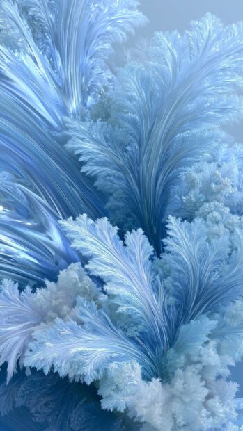 An abstract wallpaper displaying intricate light blue and white frosty ice crystals forming delicate patterns