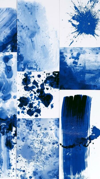A blue aesthetic wallpaper showcasing a collage of various blue paint splatters, brush strokes, and ink textures on a white background