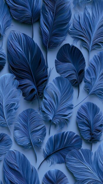 Blue aesthetic wallpaper showcasing a collection of soft blue feathers scattered across a light blue background
