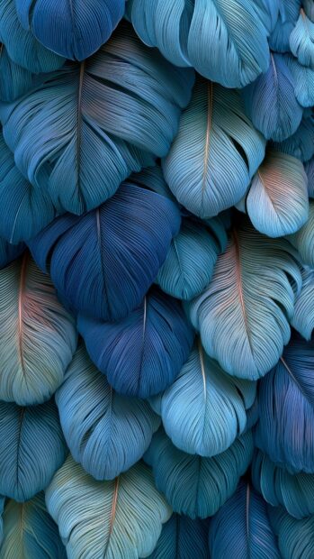 Blue Aesthetic Wallpaper displaying a detailed texture of various shades of blue feathers with subtle hints of peach