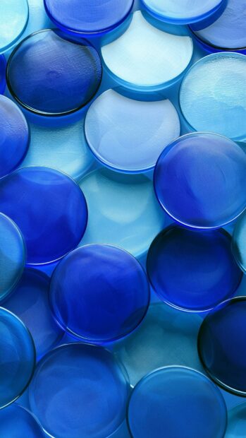 A blue aesthetic wallpaper showcasing translucent blue and white overlapping circles resembling glass pebbles