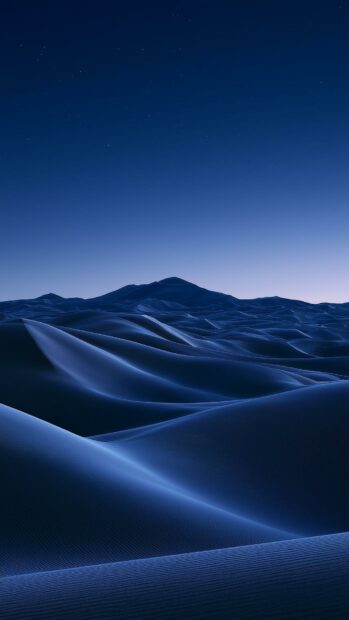 Dark aesthetic wallpaper depicting minimalist blue desert dunes under a starry night sky