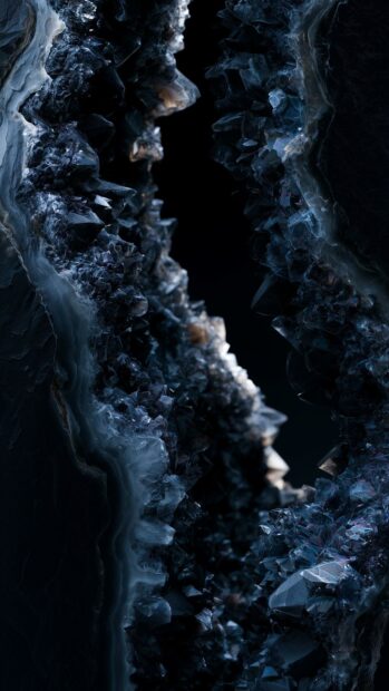 Dark aesthetic wallpaper showcasing sharp, dark blue and black crystals forming the intricate texture of a geode interior
