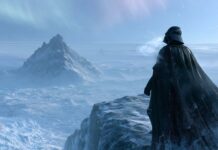 Darth Vader wallpaper standing on a snowy mountain ledge overlooking an icy landscape with an aurora borealis in the sky