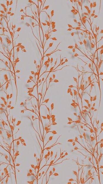 Fall aesthetic wallpaper featuring a seamless pattern of thin orange branches with small leaves on a light background