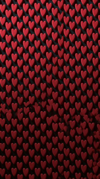 A striking hearts wallpaper showcasing a dense, textured pattern of deep red hearts with strong shadows on a dark background