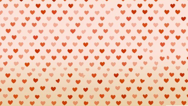 A lovely hearts wallpaper displaying a pattern of small red and light orange hearts on a soft pink to beige gradient background