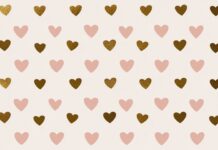 Hearts wallpaper featuring a seamless pattern of alternating light pink and golden hearts on a soft pink background