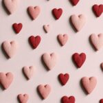 Red And Pink Textured Hearts Pattern Wallpaper