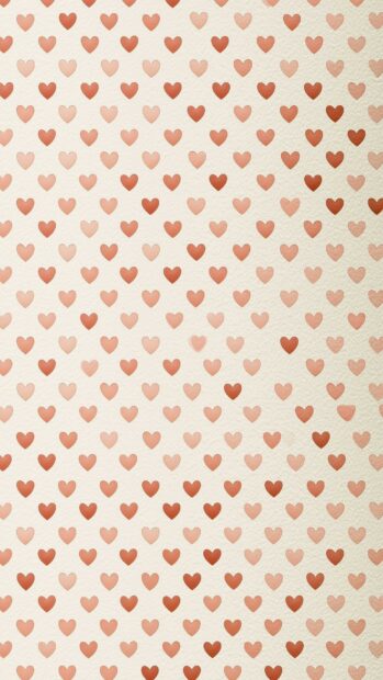 Hearts wallpaper featuring a watercolor-style pattern of small pink and red hearts with a subtle gradient effect on a textured cream background