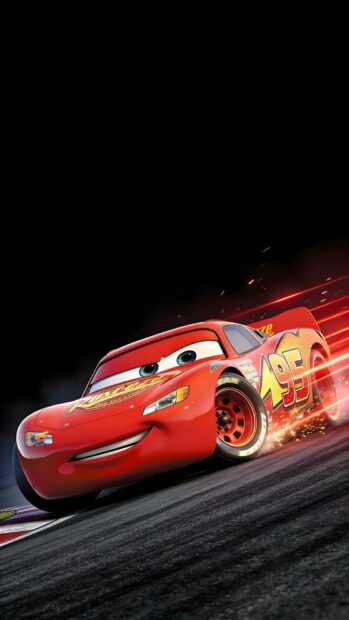Lightning Mcqueen Wallpaper showing the car racing at high speed on a dark track with motion blur and sparks