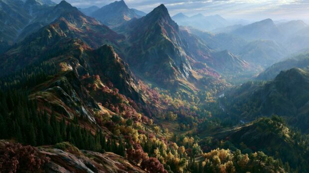 A scenic mountain wallpaper displaying rolling hills covered in colorful autumn foliage from an aerial perspective