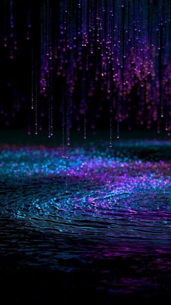 An abstract neon wallpaper depicting shimmering purple and blue light rain falling onto a dark, rippling water surface