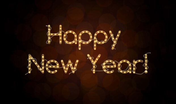 A New Year aesthetic wallpaper featuring "Happy New Year!" text made from warm golden string lights on a dark, blurred bokeh background