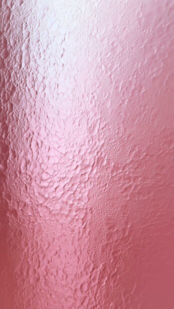 A beautiful pink aesthetic wallpaper featuring a textured metallic surface with a subtle gradient effect