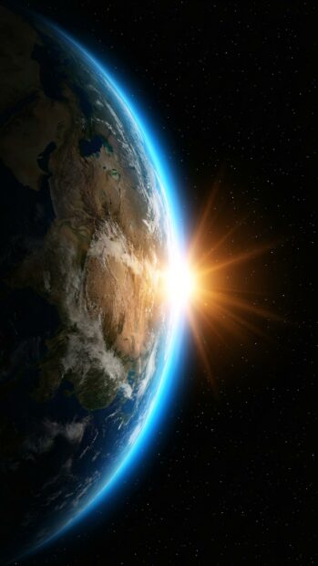 Earth wallpaper capturing a sunrise over the horizon from space