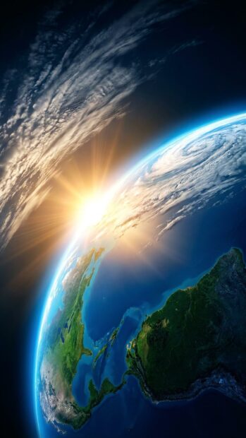 Earth with a sunrise at the horizon viewed from space