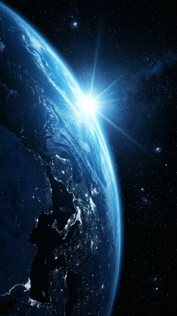 View of Earth from space with a bright sunrise, showcasing the planet's curvature and glowing atmosphere