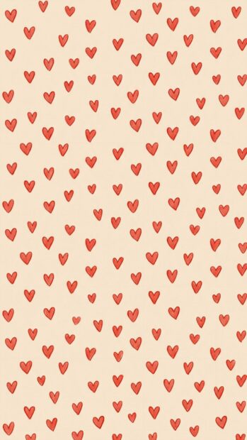 Red aesthetic wallpaper with a pattern of small red hearts on a beige background