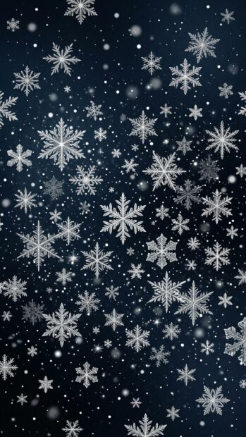 Intricate snowflakes falling against a dark background