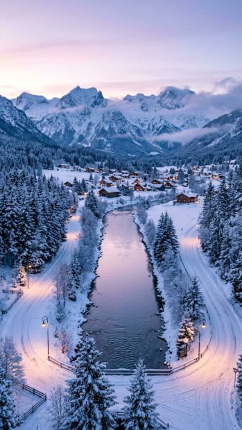 A scenic view of a snow-covered village surrounded by mountains