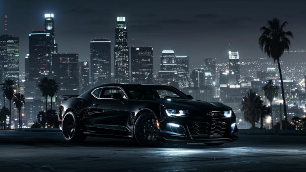 4K wallpaper Camaro SS parked in an urban setting at night, illuminated by city lights.
