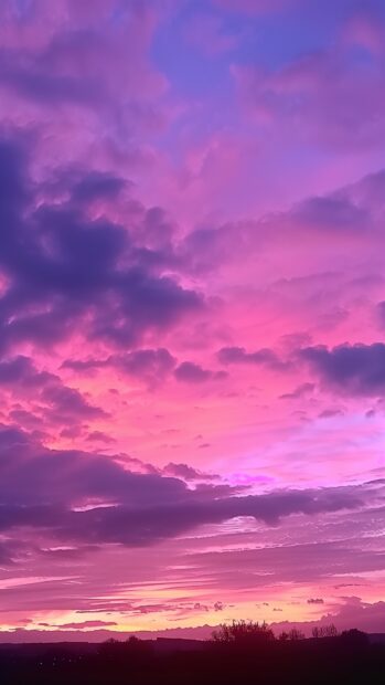 Sunset Aesthetic Wallpaper HD with majestic sunset with clouds illuminated in shades of pink and purple.