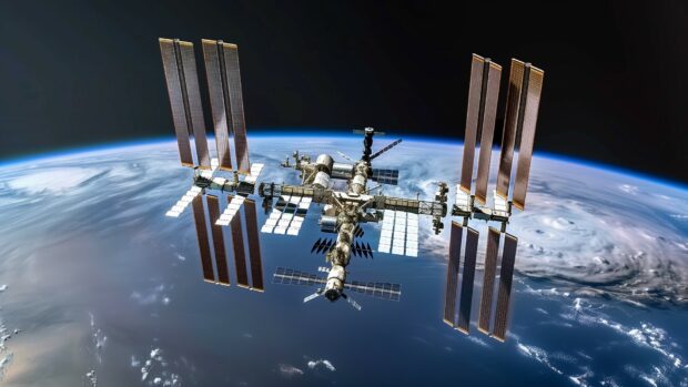 The International Space Station with astronauts performing a spacewalk.