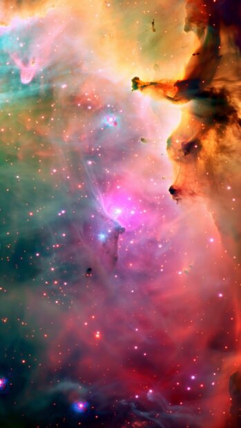 A cute galaxy with pink and orange nebulas and shimmering stars.