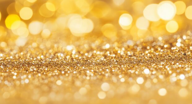 Rich golden glitter wallpaper with a luxurious texture.