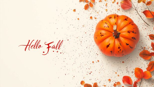 4K fall scene with a pumpkin and Hello Fall in elegant script.