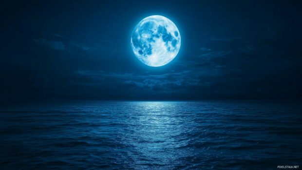 A mesmerizing Blue Moon glowing softly above a tranquil ocean, with its cool blue light reflecting off the water and creating a serene, moonlit seascape.