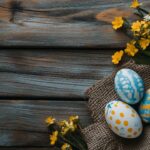 A rustic Easter arrangement with painted eggs, burlap, and spring flowers on a wooden surface, cozy atmosphere