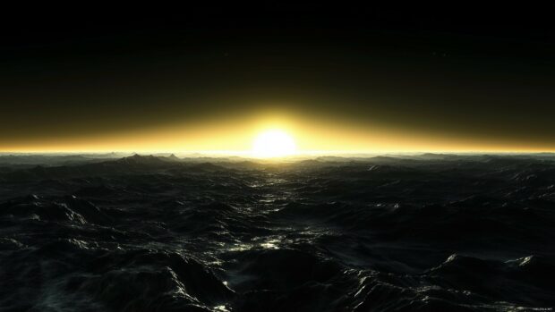 Twilight over dark mountains with a faint glow of fading sunlight on the horizon.