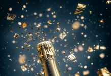 iPhone wallpaper with Champagne bottle popping open with a splash of sparkling golden liquid, with Happy New Year 2025 in luxurious calligraphy on a black and gold background.