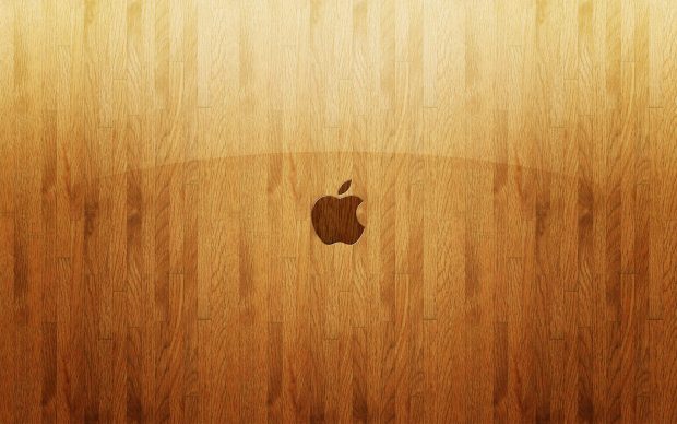 Apple on light wood images.